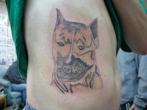 poorly executed tatto of an angry dog